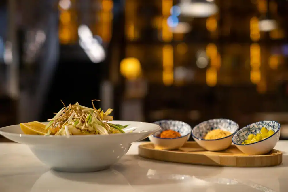Popular Thai dishes including Pad Thai prepared in Phuket